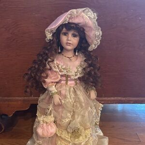 Elegant Pink and Cream Porcelain Doll